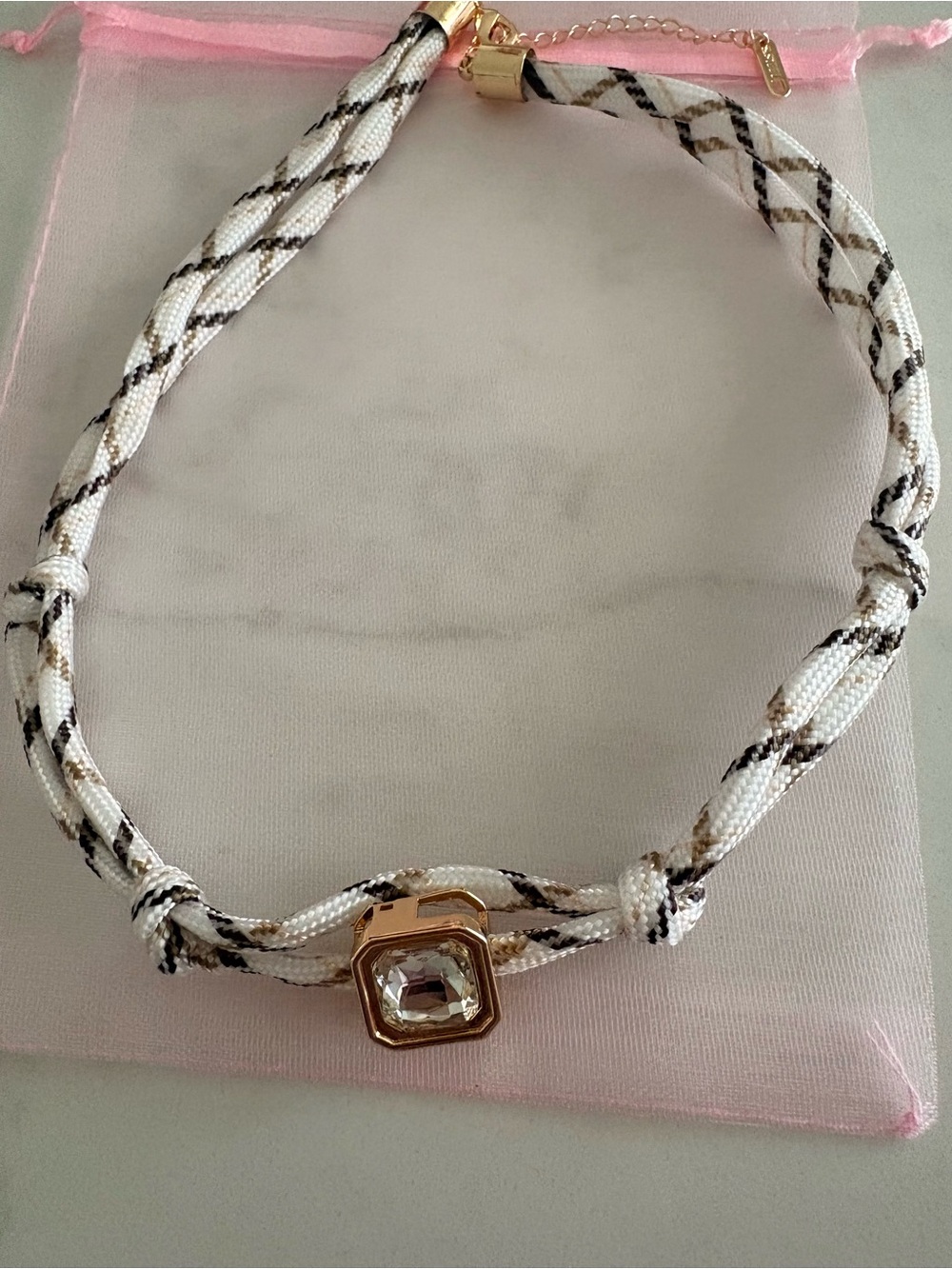 White/mocha color rope choker with gold tone & 
clear cz diamond Stainless steel